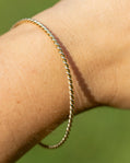 14K Twist Oval Bangle